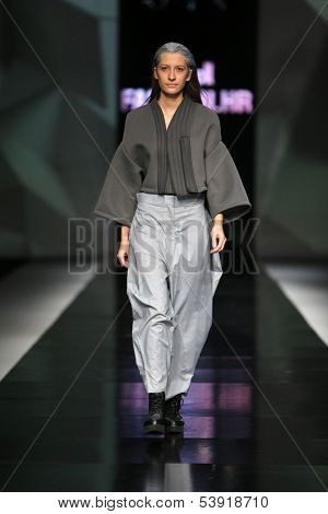 ZAGREB, CROATIA - OCTOBER 17: Fashion model wearing clothes designed by Petra Vuletic and Sasa Hortig on the 'Fashion.hr' show on October 17, 2013 in Zagreb, Croatia.