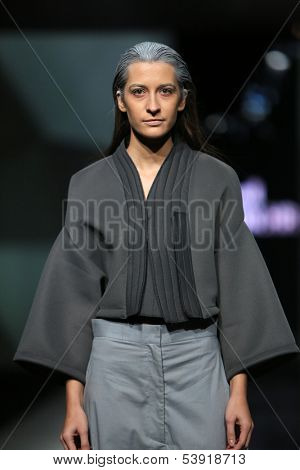 ZAGREB, CROATIA - OCTOBER 17: Fashion model wearing clothes designed by Petra Vuletic and Sasa Hortig on the 'Fashion.hr' show on October 17, 2013 in Zagreb, Croatia.