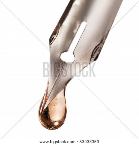 Drop Of Transparent Liquid On Nib Of Pen