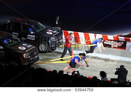 MOSCOW - MAR 02: Strong men pulled jeeps on the festival extreme sports Breakthrough 2013, on March 02, 2013 in Moscow, Russia.