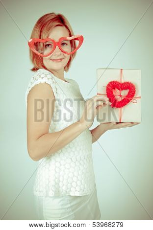 Redhead girl  with gift