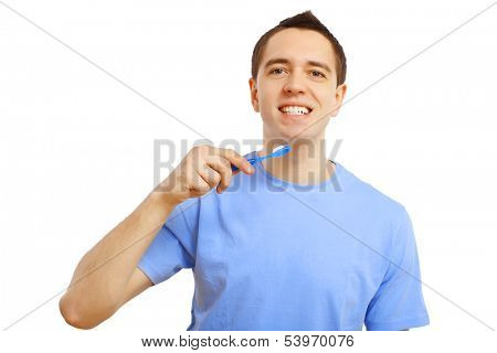 Young man in blue shirt brushing his teeth