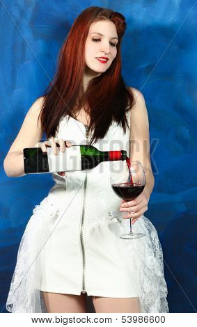 punk girl pours wine into the glass, blueback ground
