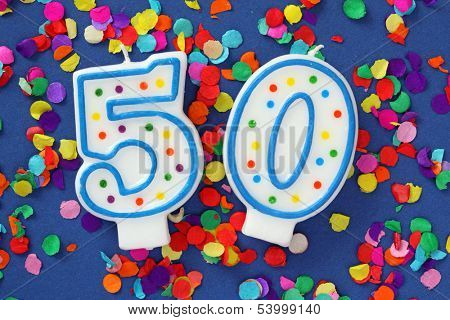 Number fifty birthday candle on red background