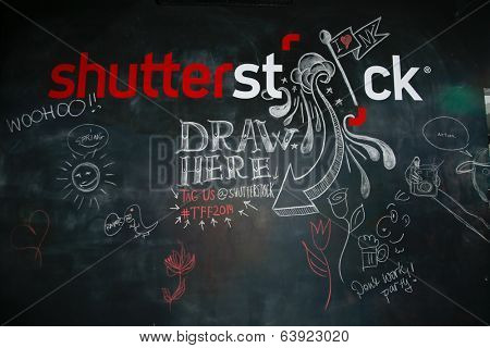 NEW YORK-APR 24: Shutterstock chalk wall at the Filmmaker Industry Party at Spin during the 2014 Tribeca Film Festival on April 24, 2013 in New York City.