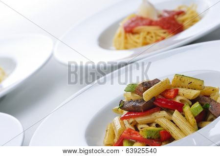 Pasta with shrimps, herbs and mashrooms isolated on white background in studio