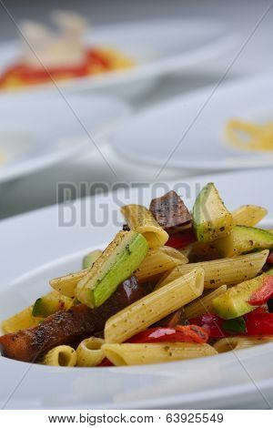Pasta with shrimps, herbs and mashrooms isolated on white background in studio