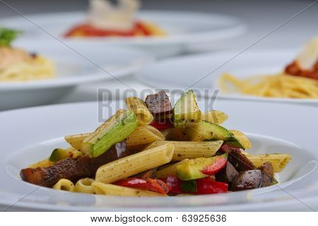 Pasta with shrimps, herbs and mashrooms isolated on white background in studio