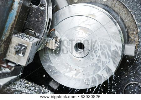 industrial metal work bore machining process by cutting tool on automated lathe