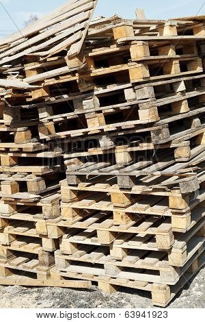 Stack Of Empty Pallets In Warehouse