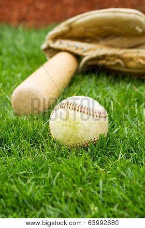 Old Base On Field With Bat And Glove