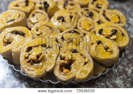 The Dough Of Cinnamon Roll With Cashew Nut And Raisin