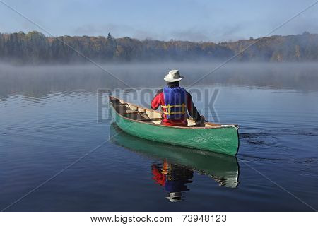 Canoeing On An Autumn Lake