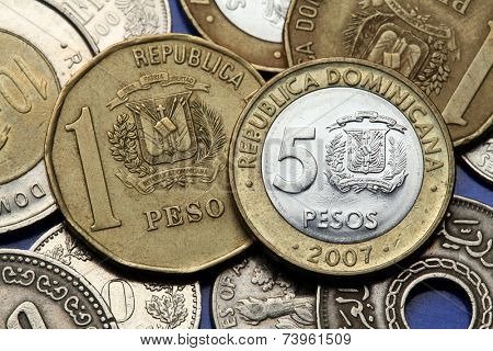 Coins of the Dominican Republic. Dominican national coat of arms depicted in the Dominican one and five peso coins.