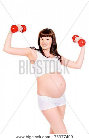 Beautiful pregnant woman doing exercise with dumbbells. Healthcare. Isolated over white.