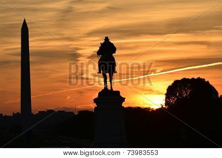 Ulysses S. Grant Memorial and Washington Monument silhouettes in sunset - Washington DC, United States of America