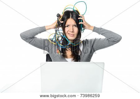 Woman Putting Cables On Head While Using Laptop