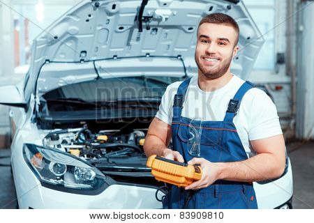 Car mechanic at the service station