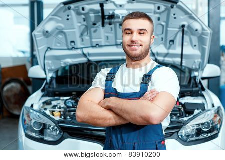 Car mechanic at the service station