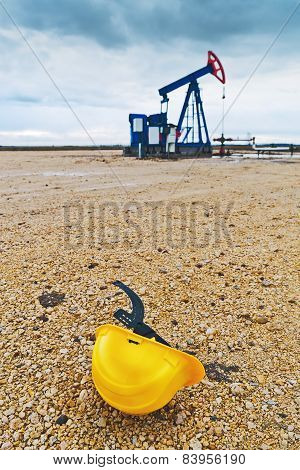 Pumpjack Oil Pump And Protective Helmet