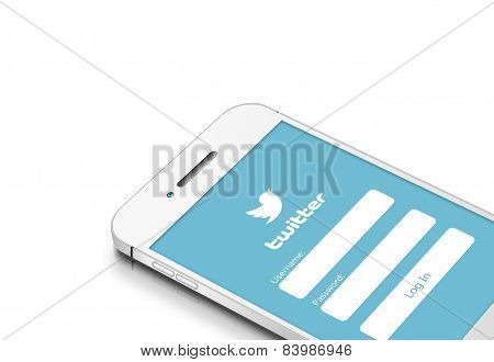 Gdansk, Poland - March 2, 2015: White Mobile Phone With Twitter Social Network Isolated Over White