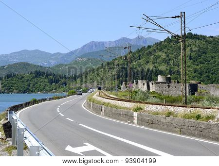 Motorway and electrified railway track by the lake