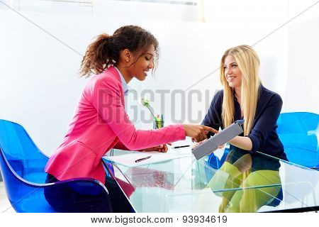 businesswomen interview meeting multi ethnic african and blond sitting at office