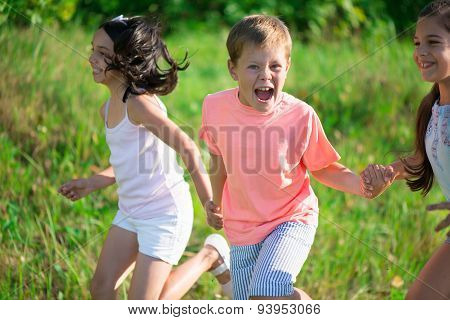 Group Of Happy Children Playing