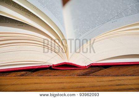 Red book on a wooden chair