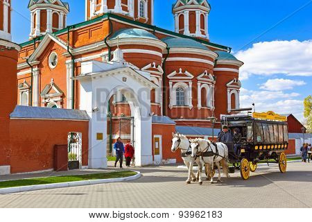 KOLOMNA, RUSSIA - MAY 03, 2014: Horse-drawn carriages (omnibus) in Kolomna Kremlin - Russia - Moscow region.