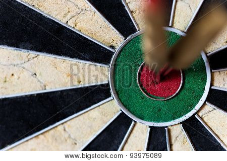 Dartboard With Steeldarts In Bullseye