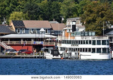 LAKE GEORGE, NY - SEP 24: Cruises around Lake George in New York State, as seen on Sep 24, 2016. The lake lies within the upper region of the Great Appalachian Valley and drains all the way northward into Lake Champlain and the St. Lawrence River drainage