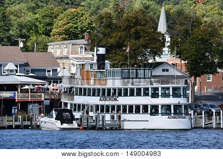 LAKE GEORGE, NY - SEP 24: Cruises around Lake George in New York State, as seen on Sep 24, 2016. The lake lies within the upper region of the Great Appalachian Valley and drains all the way northward into Lake Champlain and the St. Lawrence River drainage
