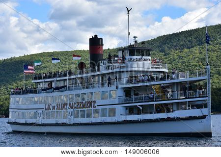 LAKE GEORGE, NY - SEP 24: Cruises around Lake George in New York State, as seen on Sep 24, 2016. The lake lies within the upper region of the Great Appalachian Valley and drains all the way northward into Lake Champlain and the St. Lawrence River drainage