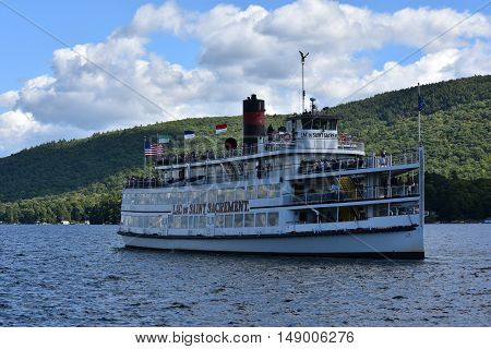 LAKE GEORGE, NY - SEP 24: Cruises around Lake George in New York State, as seen on Sep 24, 2016. The lake lies within the upper region of the Great Appalachian Valley and drains all the way northward into Lake Champlain and the St. Lawrence River drainage