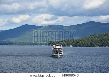 LAKE GEORGE, NY - SEP 24: Cruises around Lake George in New York State, as seen on Sep 24, 2016. The lake lies within the upper region of the Great Appalachian Valley and drains all the way northward into Lake Champlain and the St. Lawrence River drainage