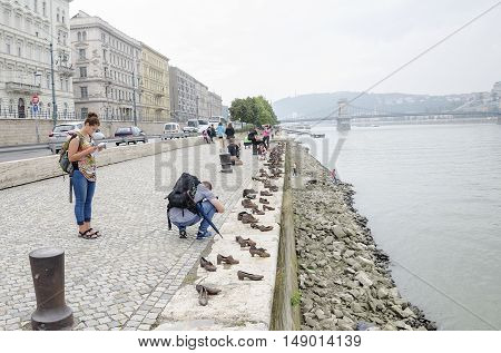 BUDAPEST, HUNGARY - SEPTEMBER 17: Shoes on the Danube Promenade - a monument to victims of the Holocaust, on September 17, 2016 in Budapest, Hungary.