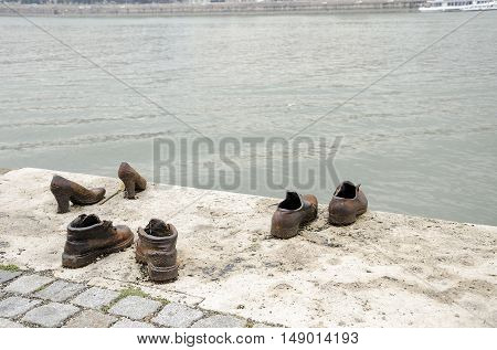 BUDAPEST, HUNGARY - SEPTEMBER 17: Shoes on the Danube Promenade - a monument to victims of the Holocaust, on September 17, 2016 in Budapest, Hungary.