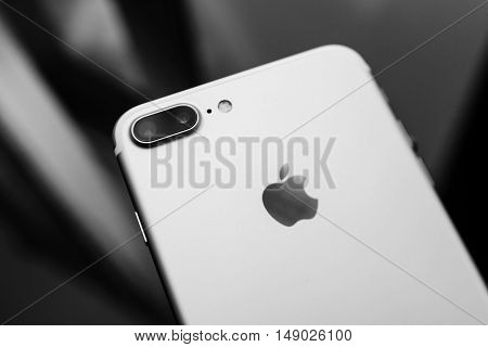 PARIS FRANCE - SEP 26 2016: New Apple iPhone 7 Plus unboxing and testing - black and white phone on glass background . New iPhone7 is one of the best waterproof smart phone in the world