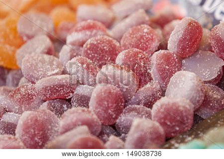Berries of the forest sweet jellies at street market stall