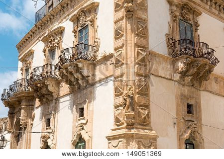An old baroque palace seen in the village of Scicli in Sicily, Italy