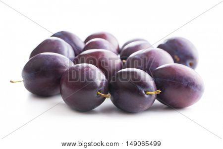 Fresh ripe plums isolated on white background.