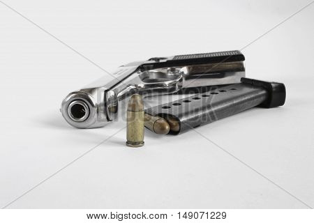 Pistol and ammunition on the white background.