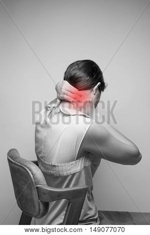 Young woman having pain in the neckPain in the neck