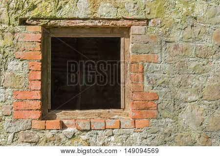 architectural background of a glassless brick surround window frame