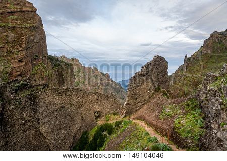 Walking path from Pico Ruivo to Pico Arieiro in the rocky mountains of Madeira island.