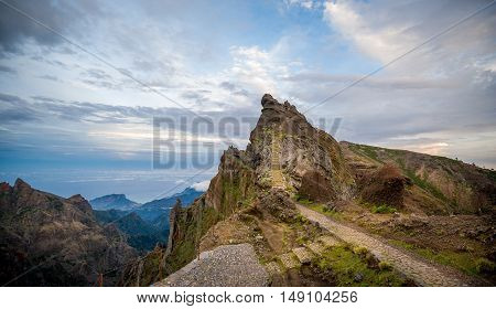 Sunset at Pico Arieiro, Madeira island. Rocky mountains and beautiful hiking path panoramic landscape.