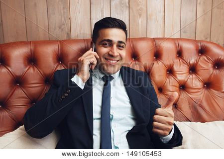 Businessman with thumb up hand sign, free space. Successful business problems solving. Feeling like, satisfaction concept.