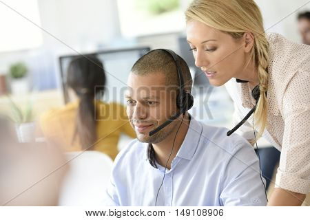Teleoperator in office with manager