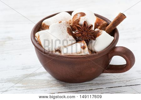Winter hot drink. Hot chocolate with marshmallow and spices.
